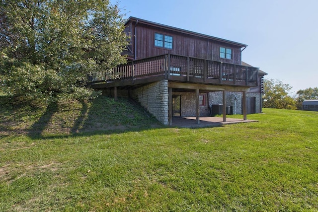 back of house with a yard, a patio area, and a deck