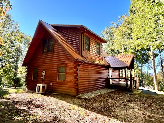 view of property exterior with central AC