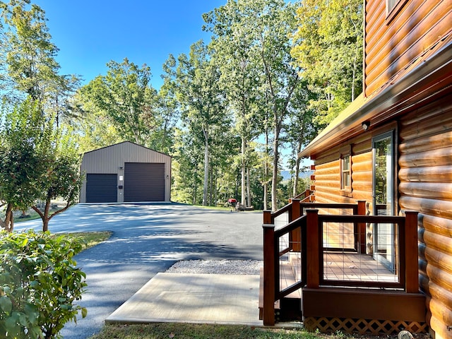 exterior space featuring a garage and an outdoor structure