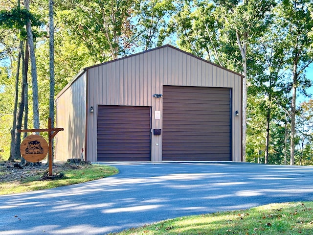 garage featuring wooden walls