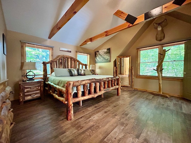 bedroom with beamed ceiling, hardwood / wood-style floors, and high vaulted ceiling