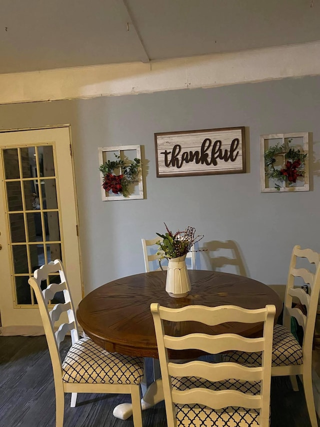 dining room with dark hardwood / wood-style flooring