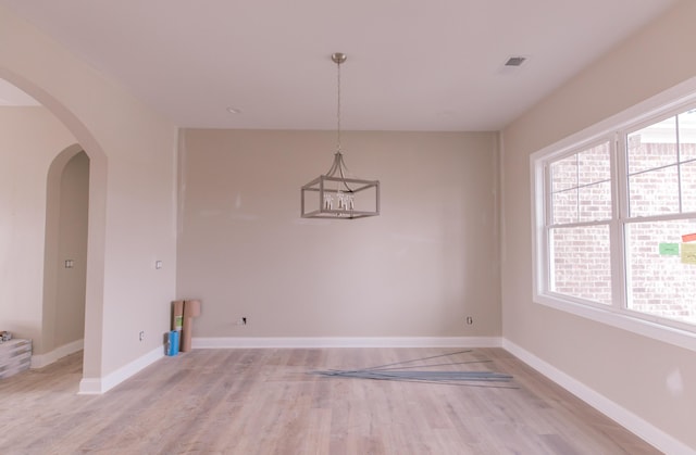 unfurnished dining area featuring light hardwood / wood-style flooring