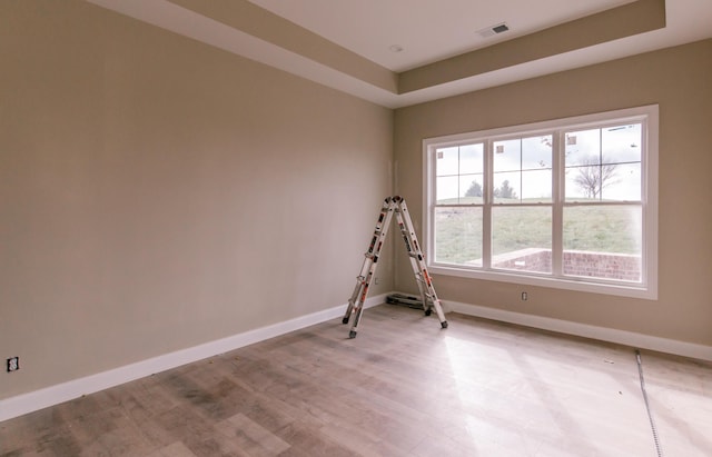 empty room with a tray ceiling