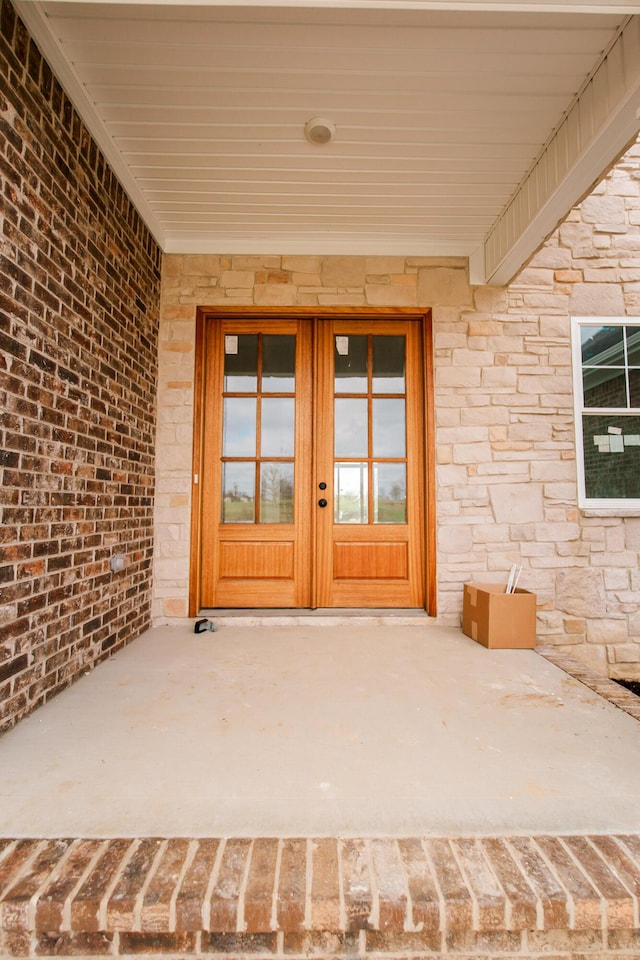 property entrance featuring french doors