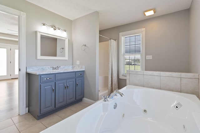 full bathroom with a whirlpool tub, tile patterned flooring, vanity, and a shower with shower curtain
