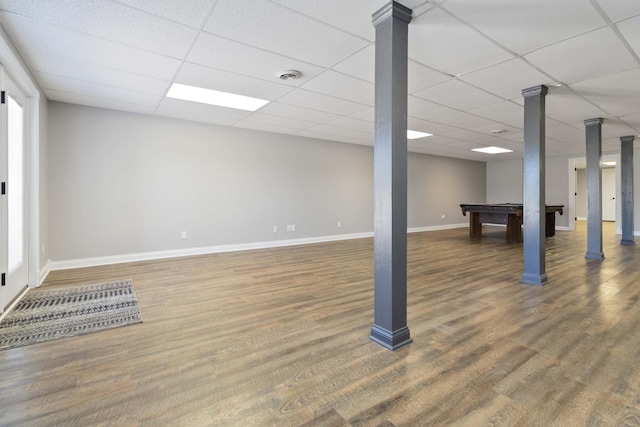 basement featuring visible vents, baseboards, a paneled ceiling, billiards, and wood finished floors