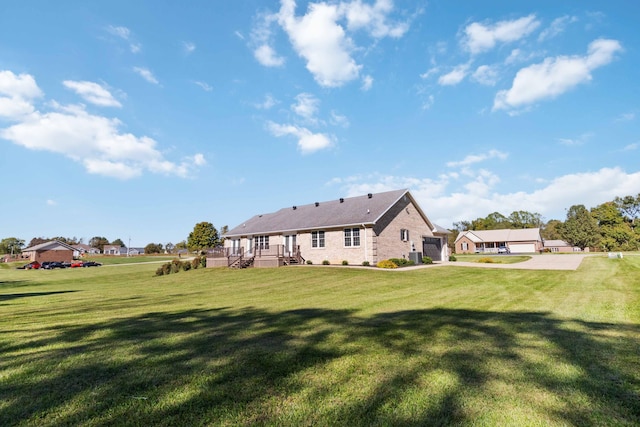 rear view of house featuring a lawn