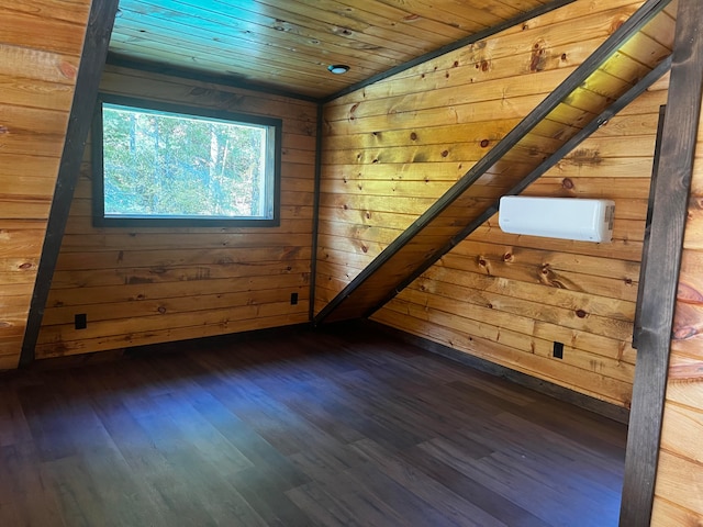 bonus room featuring vaulted ceiling, wood ceiling, wood walls, and dark wood-type flooring