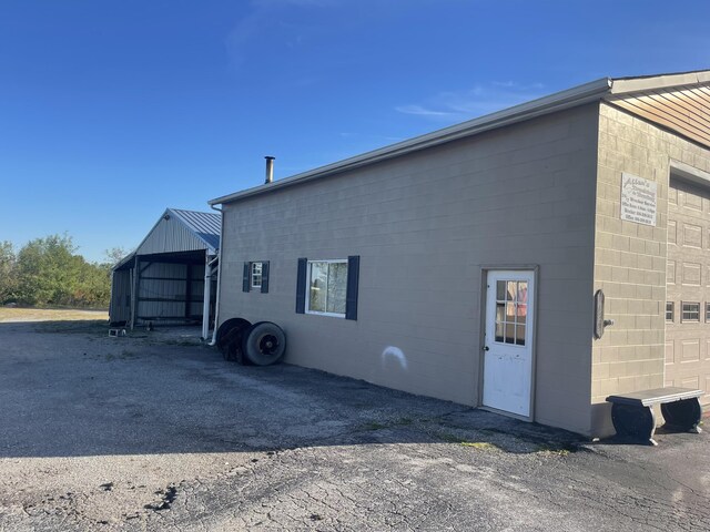 view of side of home featuring a garage