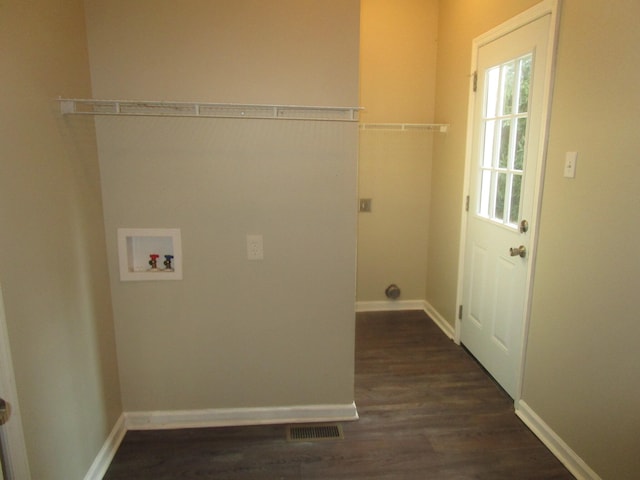 laundry area featuring washer hookup and dark wood-type flooring