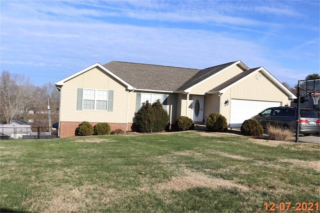 ranch-style house with a garage and a front yard