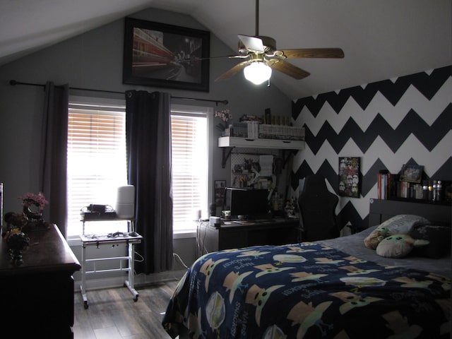 bedroom featuring ceiling fan, wood-type flooring, lofted ceiling, and multiple windows