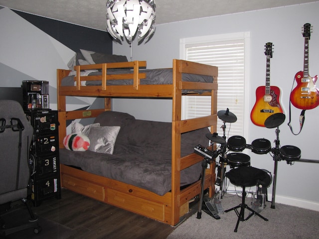 bedroom with dark hardwood / wood-style flooring