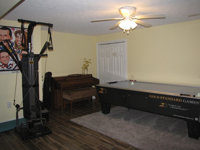 game room featuring ceiling fan and dark hardwood / wood-style flooring