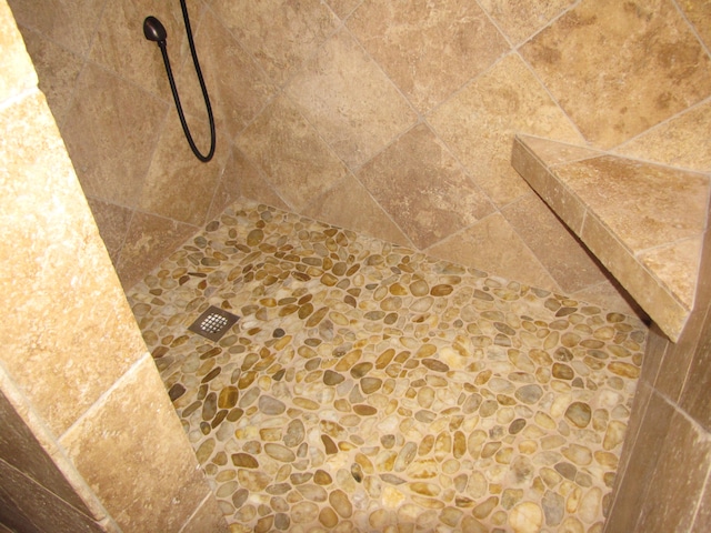 details with a tile shower