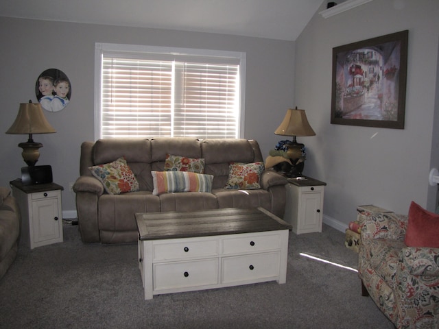 carpeted living room with lofted ceiling