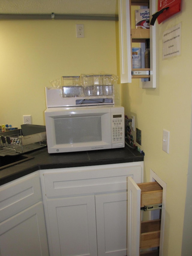 kitchen with white cabinets