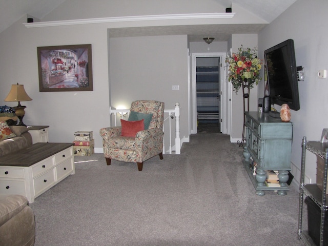 carpeted living room with lofted ceiling