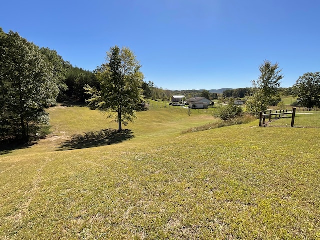 view of yard with a rural view