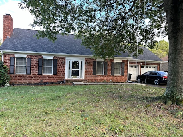 view of front of home with a front yard, a shingled roof, a chimney, a garage, and brick siding