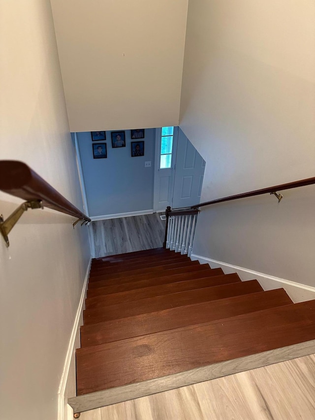 stairs with wood-type flooring