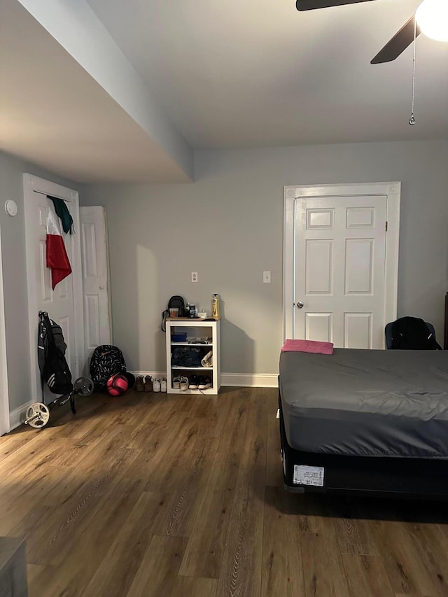 bedroom featuring dark wood-type flooring and ceiling fan