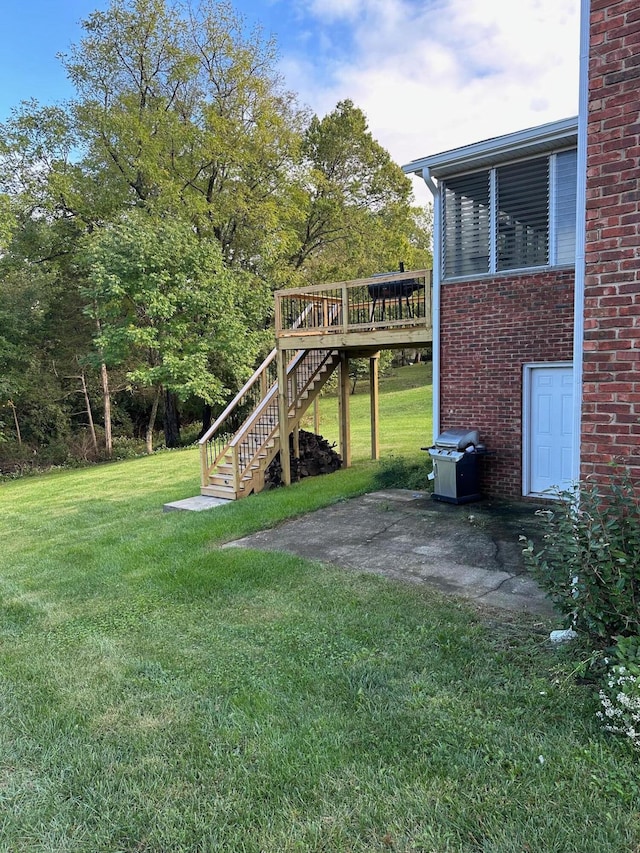 view of yard with a wooden deck