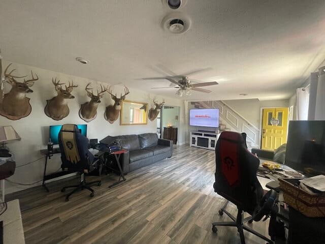 office space with dark wood-type flooring and ceiling fan