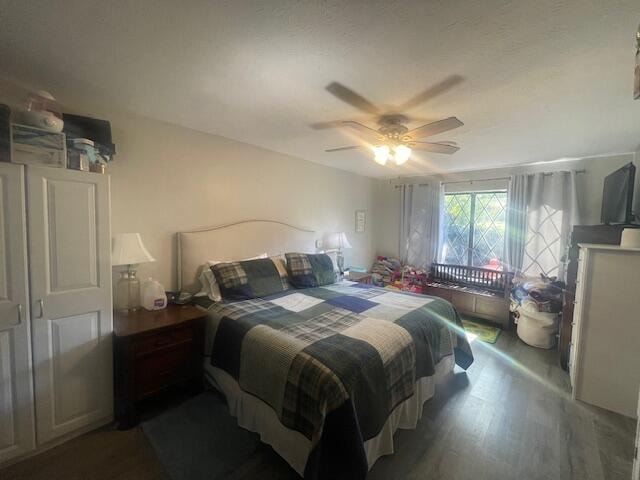 bedroom featuring ceiling fan and hardwood / wood-style floors