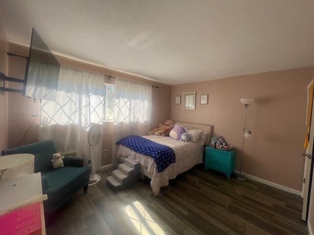 bedroom featuring dark hardwood / wood-style flooring