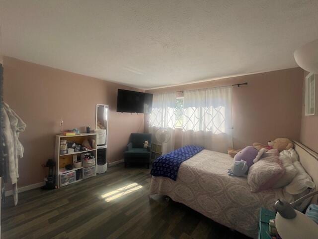 bedroom featuring dark hardwood / wood-style floors