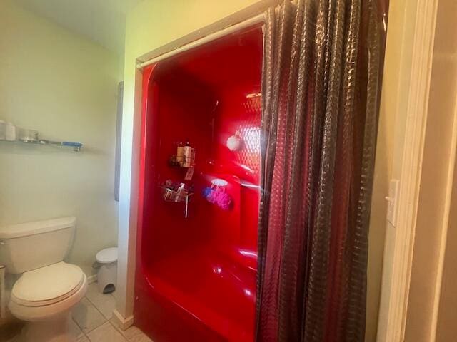 bathroom with tile patterned floors and toilet