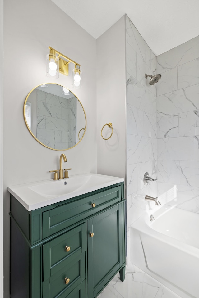 bathroom with tiled shower / bath and vanity