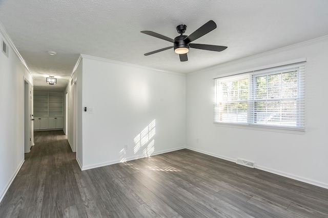 unfurnished room with dark wood-type flooring, ornamental molding, a textured ceiling, and ceiling fan