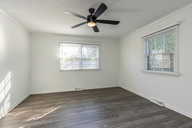 empty room featuring ceiling fan, ornamental molding, a textured ceiling, and dark hardwood / wood-style flooring