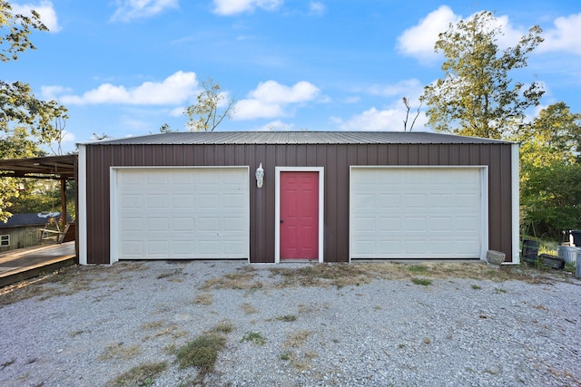 garage featuring wooden walls