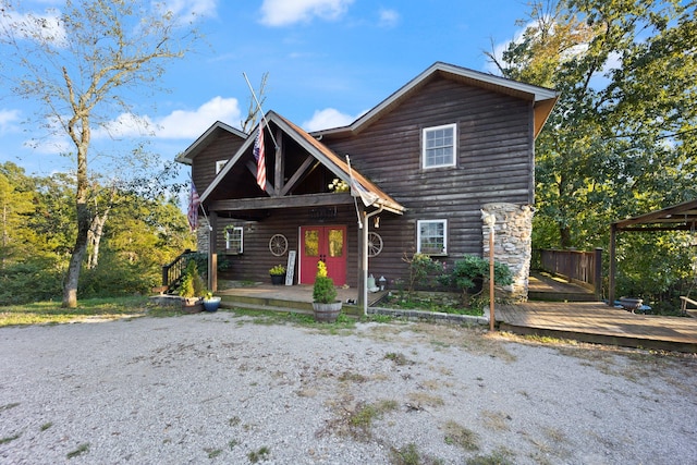 front facade with a wooden deck