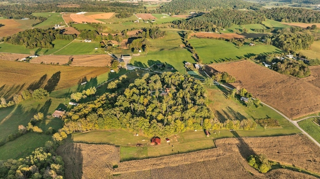 birds eye view of property with a rural view