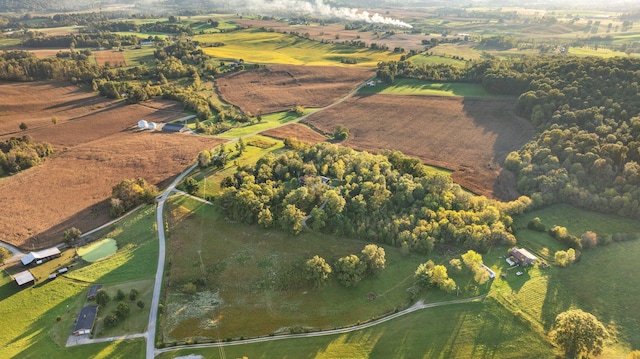 birds eye view of property with a rural view