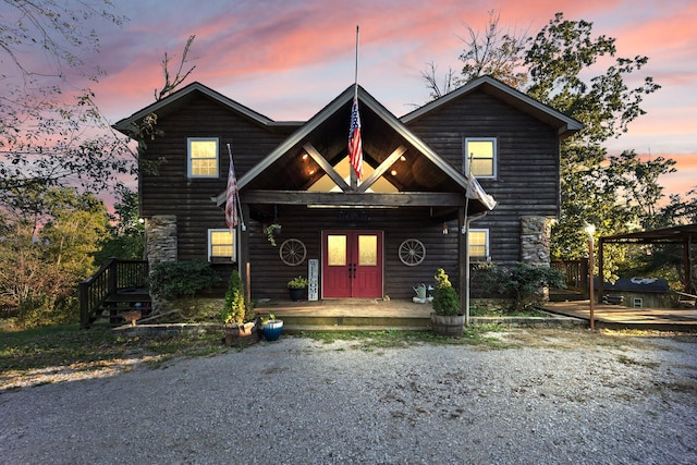 log home featuring a porch