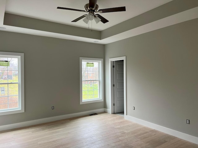 spare room featuring light hardwood / wood-style floors and ceiling fan