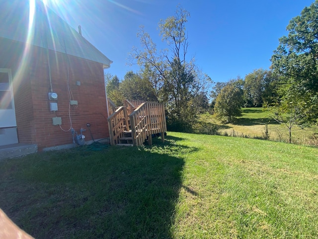 view of yard featuring a wooden deck