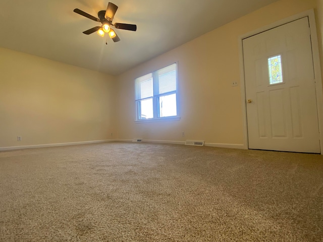 entryway with carpet flooring and ceiling fan