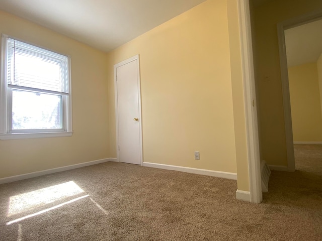 unfurnished room featuring carpet flooring