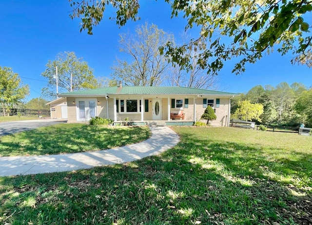 ranch-style house featuring a front lawn