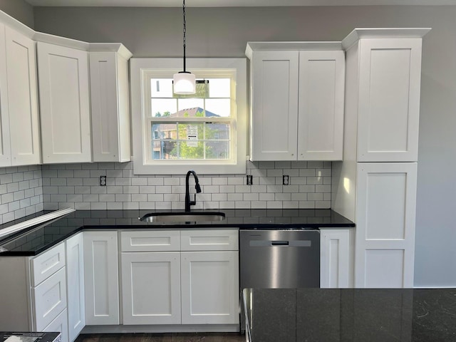 kitchen featuring dishwasher, sink, and white cabinetry