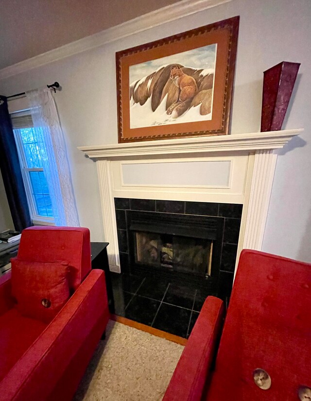 details with ornamental molding and a tiled fireplace