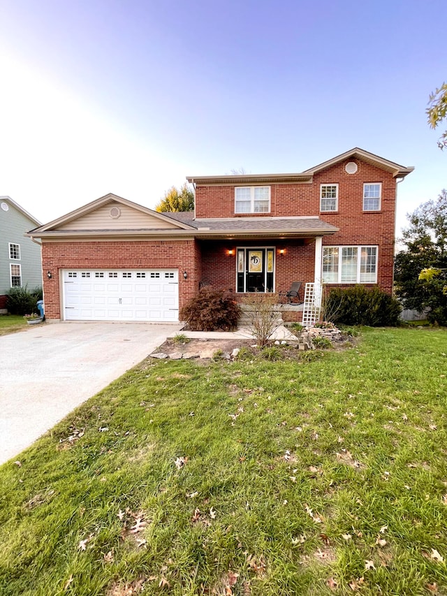 view of front facade with a front yard and a garage