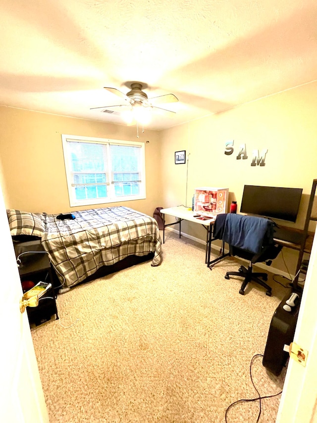 carpeted bedroom featuring ceiling fan